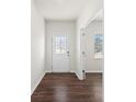 Bright entryway with hardwood floors and a glass-paneled door at 221 Wildflower Dr, Locust, NC 28097