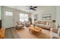 Bright living room with hardwood floors, comfy seating, and large windows at 2328 Sanders Ave, Charlotte, NC 28216