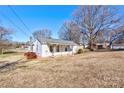 Front yard view of a white house with a yard at 304 Edel St, Kings Mountain, NC 28086