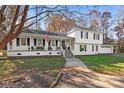 Charming two-story home with a covered porch and attached garage at 4501 Brookwood Rd, Charlotte, NC 28215