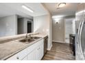 Kitchen view featuring stainless steel appliances, double sink, and an open layout at 4901 Smokehollow Rd, Charlotte, NC 28227