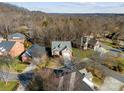 Aerial view of a neighborhood with houses and trees at 5428 Old Course Dr, Cramerton, NC 28032