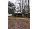 Backyard with storage shed and covered carport at 7119 Neal Rd, Charlotte, NC 28262