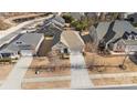 A high angle of a home with a manicured lawn, mature trees, and a concrete driveway at 9307 Dufaux Dr, Charlotte, NC 28278