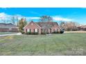 Two-story brick home with a spacious lawn at 1011 Emerson Dr, Mooresville, NC 28115