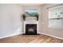 Living room corner fireplace with mantel and hardwood floors at 105 Clarendon St # E, Mooresville, NC 28117