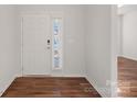 Bright entryway with hardwood floors and white door at 116 Van Gogh Trl, Mount Holly, NC 28120