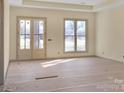 Bright and spacious living room with large windows and double doors at 1212 Donna Dr, Shelby, NC 28152