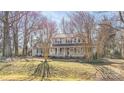 Two-story house with gray siding, porch, and a landscaped yard at 13010 Marlstone Ln, Charlotte, NC 28215