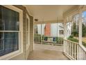 Front porch with a porch swing and white railings at 13010 Marlstone Ln, Charlotte, NC 28215