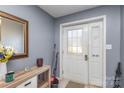 Bright entryway with a console table and mirror at 2465 Cedar Valley Dr, Conover, NC 28613