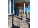 Stone front porch with flagstone flooring and columns at 250 Bost Rd, China Grove, NC 28023