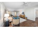 Living room featuring hardwood floors, neutral decor, and a ceiling fan at 2514 Ringwood St, Charlotte, NC 28208