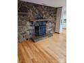 Stone fireplace with wooden mantel in living room at 44101 Millingport Rd, Richfield, NC 28137