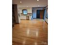 Bright kitchen features white cabinets and hardwood floors at 44101 Millingport Rd, Richfield, NC 28137