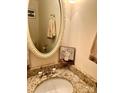 Bathroom with granite countertop and oval mirror at 4618 Old Lantern Way, Charlotte, NC 28212