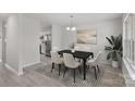 Dining room with a table, chairs, and kitchen view at 709 Ferrell Ave, Charlotte, NC 28216