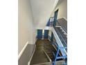 Clean condo interior stairwell with blue railings at 9401 Old Concord Rd # A, Charlotte, NC 28213