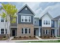 Townhome with gray and brick exterior, landscaping at 1108 Verdigris Dr # 802/0802, Gastonia, NC 28054