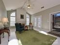 Bright sunroom with fireplace, creating a cozy atmosphere at 11928 Ludwell Branch Ct, Charlotte, NC 28277