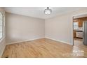 Dining Room with hardwood floors and natural light adjacent to the updated kitchen at 122 Lowry Row, York, SC 29745