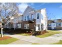 Charming townhome with brick facade, private balcony, professional landscaping, and inviting curb appeal at 1229 Kohler Ave, Charlotte, NC 28206