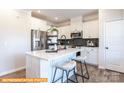 Modern kitchen with white cabinets, quartz countertops, and kitchen island at 6308 Honor Ave, Midland, NC 28107