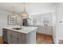 Modern kitchen with white cabinets, quartz countertops and island at 1314 Ordermore Ave, Charlotte, NC 28203