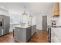 Modern kitchen with white cabinets, quartz counters, and island at 1314 Ordermore Ave, Charlotte, NC 28203