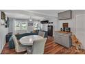 Bright dining area with round table and chairs, adjacent to living room at 2714 Springway Dr, Charlotte, NC 28205