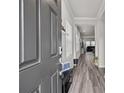 Open entryway with gray door and view to living room at 310 Hyssop Ct, Fort Mill, SC 29715