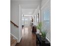 Hallway with hardwood floors and views into the living room and stairs at 337 Hyssop Ct, Fort Mill, SC 29715