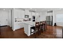 Modern kitchen with white cabinets, quartz countertops, and stainless steel appliances at 337 Hyssop Ct, Fort Mill, SC 29715
