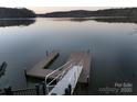 Private dock with multiple platforms and steps leading to the lake at 42610 Moonshine Dr, New London, NC 28127