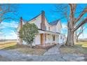 Brick and white farmhouse with a walkway leading to its front entrance at 550 Woodleaf Barber Rd, Cleveland, NC 27013