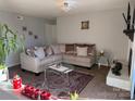 Well-lit living room featuring neutral colors, a decorative fireplace, and plush seating at 11121 S Harrowfield Rd, Charlotte, NC 28226