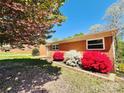 Lovely brick home with blooming azaleas and mature landscaping, creating a welcoming curb appeal at 1160 Nw 11Th Street Cir, Hickory, NC 28601