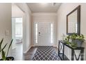 Bright and airy entryway with a patterned rug and a large mirror at 14207 Asbury Park Rd, Huntersville, NC 28078