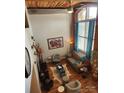 Spacious living room with exposed brick, high ceilings, and hardwood floors at 201 Hoskins Rd # 115, Charlotte, NC 28208