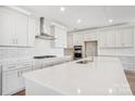 Modern kitchen featuring white cabinets, a large island, and stainless steel appliances at 224 Windy Dell Dr, Tega Cay, SC 29708