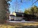 Fenced backyard with patio furniture and snowy ground at 2515 Cliffside Dr, Statesville, NC 28625