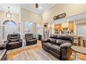 Spacious living room featuring hardwood floors, high ceilings, and comfortable leather seating at 311 Kaitlyn Ln, Kings Mountain, NC 28086