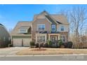 Beautiful two-story home with a two-car garage and stone accents on a well-maintained lot at 334 Cotton Field Rd, Indian Land, SC 29707