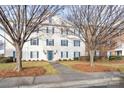 Two-story building exterior with blue shutters and a walkway at 3809 Carl Parmer Dr, Harrisburg, NC 28075