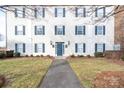 Two-story building exterior with blue shutters and a walkway at 3809 Carl Parmer Dr, Harrisburg, NC 28075