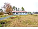 Lovely home with a red roof, carport, and a large yard, offering comfortable living space at 4926 Nc Highway 109 South, Mount Gilead, NC 27306