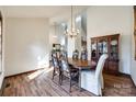 Formal dining room features hardwood floors and a charming chandelier at 78 Honeysuckle Woods, Lake Wylie, SC 29710