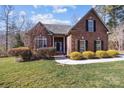 Attractive brick home with a well-maintained lawn at 254 Streamside Pl, Mooresville, NC 28115