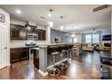 Open kitchen with island, granite counters, and stainless steel appliances at 3033 Honeylocust Ln, Fort Mill, SC 29707