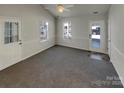 Bright living room with neutral carpeting and access to the backyard at 4210 Manchester Ln, Monroe, NC 28110